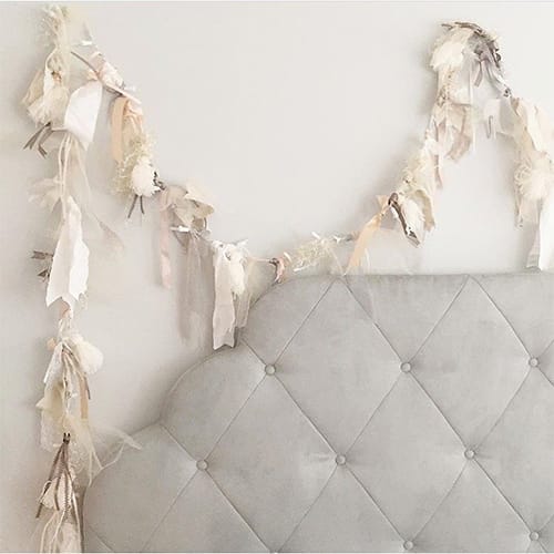 String lighting with tassels hanging from it.