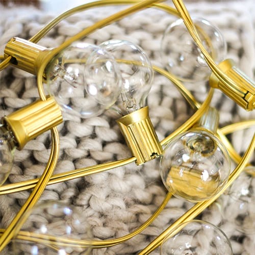 Light bulbs on a gilded string.