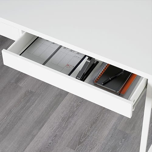 An office desk with a drawer.