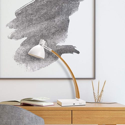 A home office with a desk lamp.