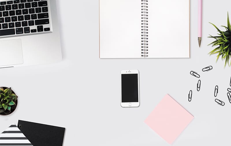 Home office supplies on top of a desk.