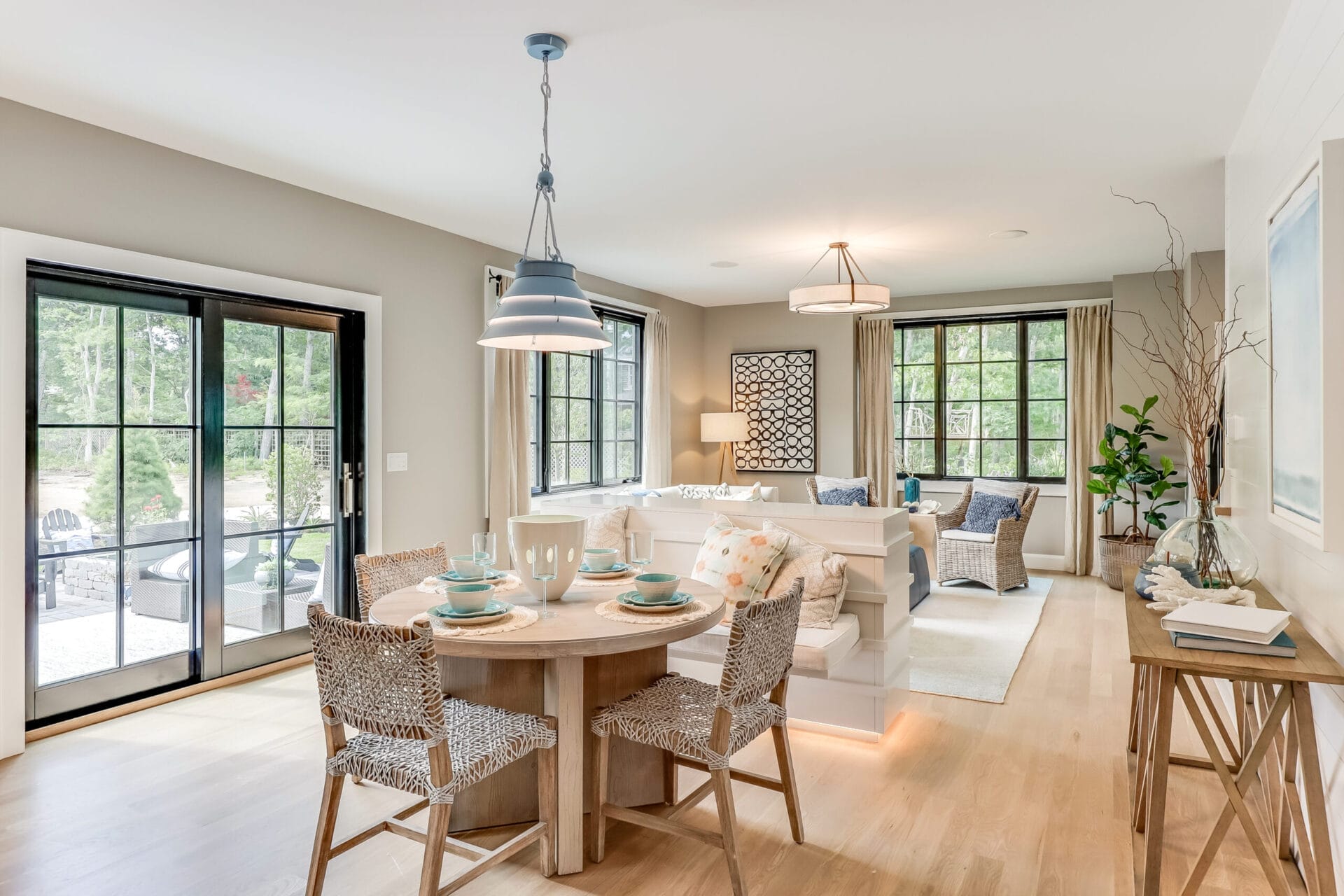 A living room with hanging lighting fixtures.