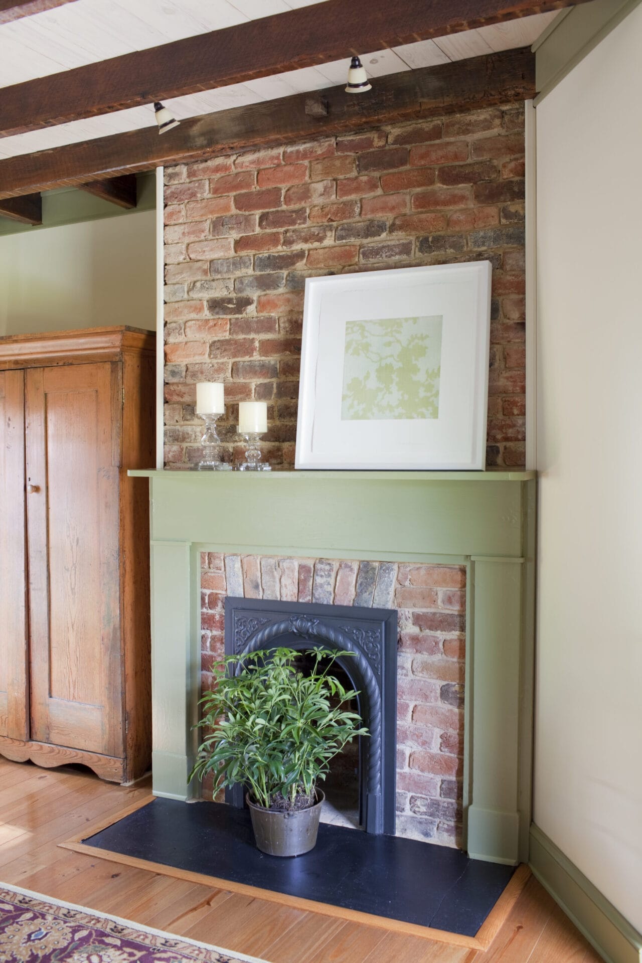 Fire place with a hearth painted using green milk paint.