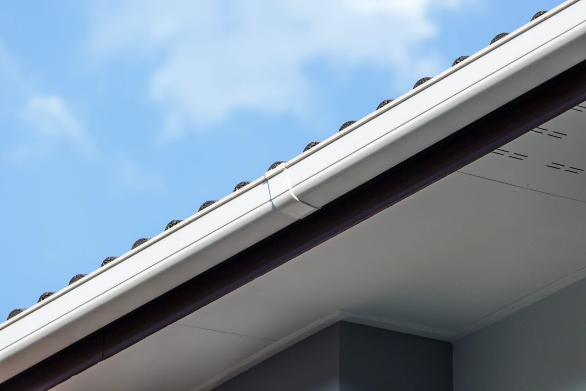 View of a white K-style gutter from underneath.