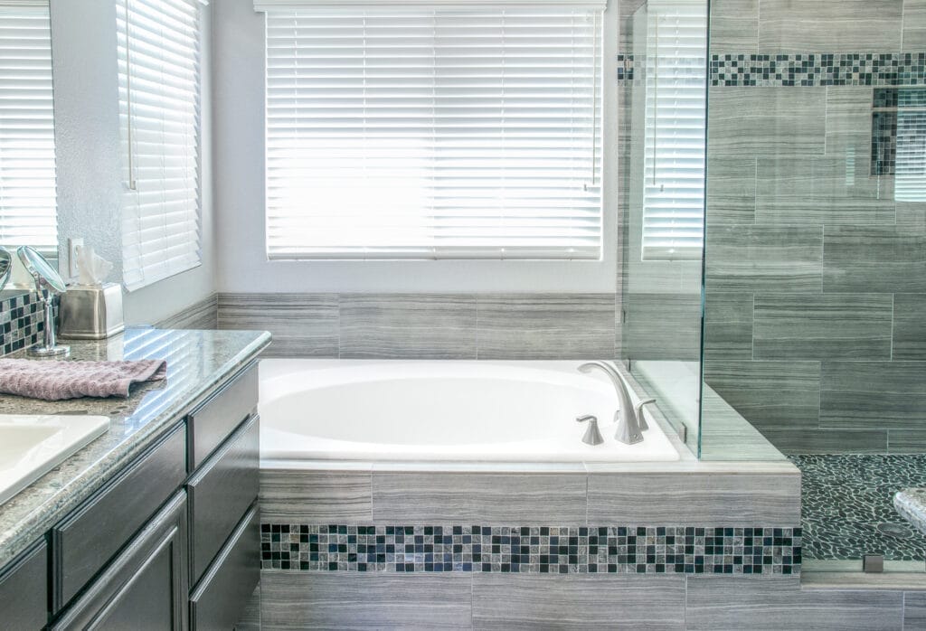 A bathtub that has been deep cleaned, it is white and spotless.