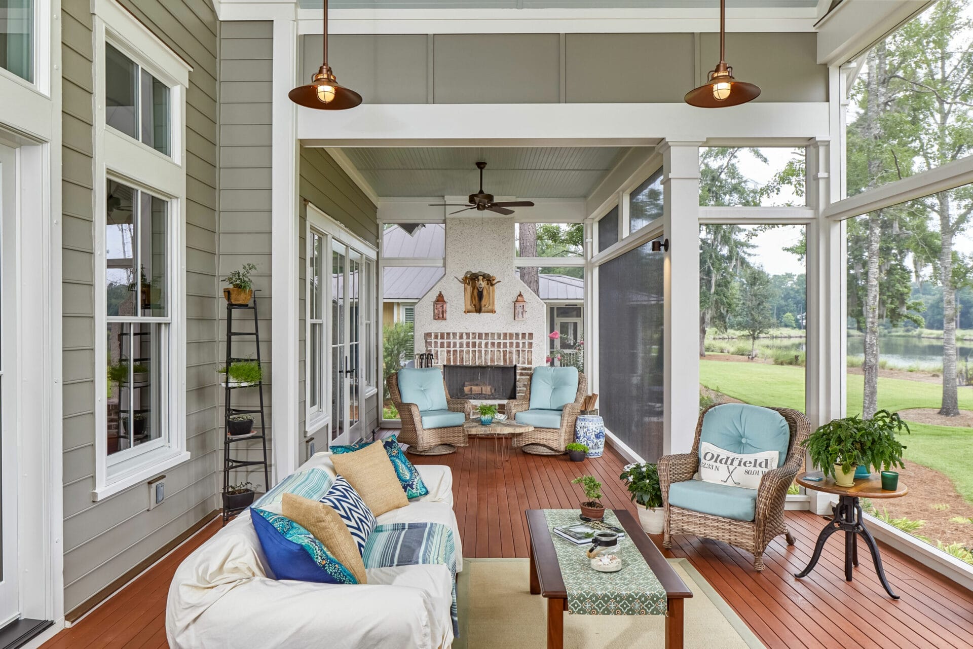 Screened in porch with a coastal design scheme.