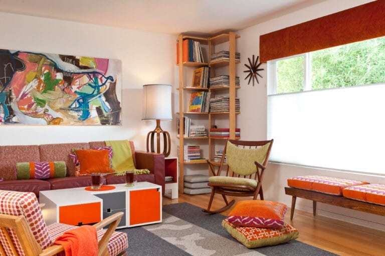 A sitting room with a home library in the corner.