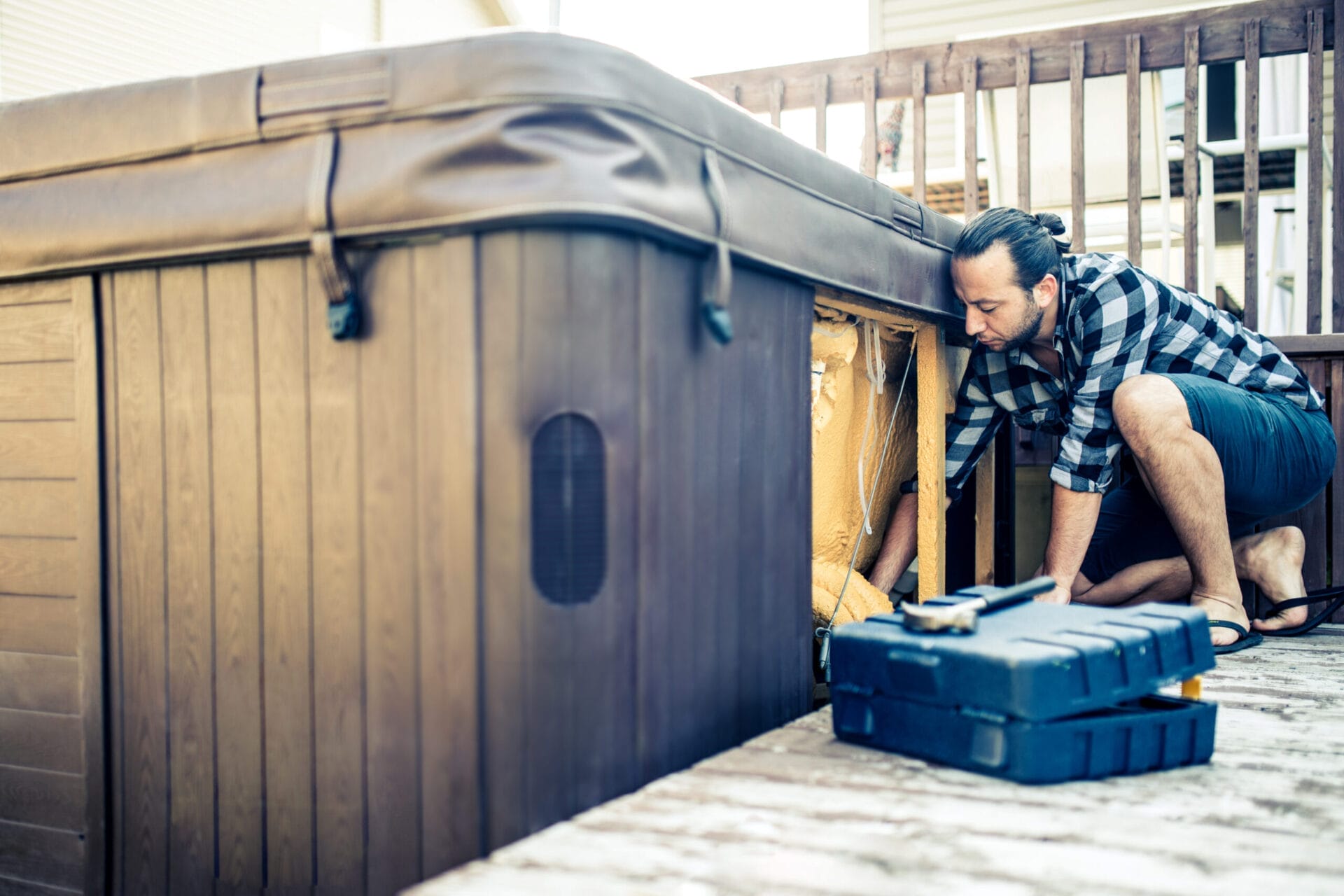 A mean dealing with his hot tub's installation leaking.
