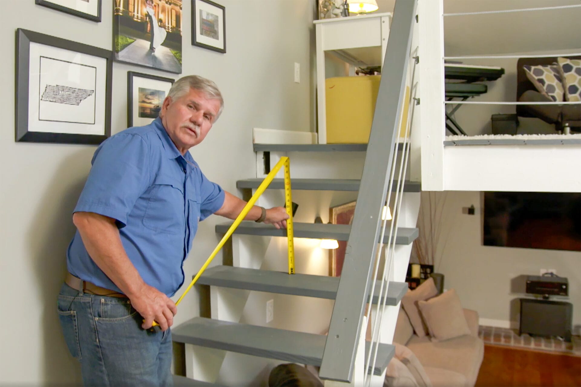 A man using a measuring tape to measure the vertical distance between two steps.