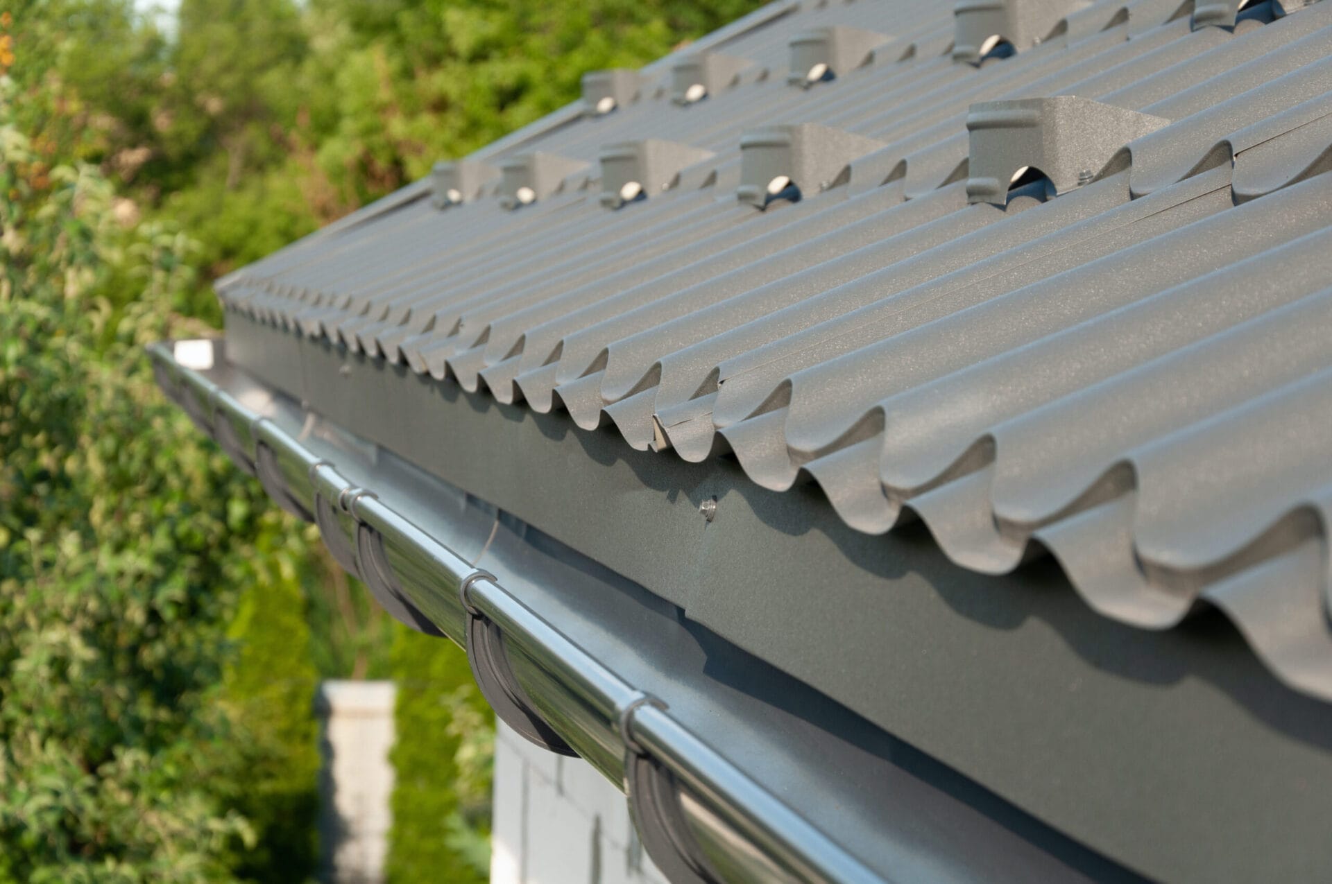 Metal half-round gutter system on a house.
