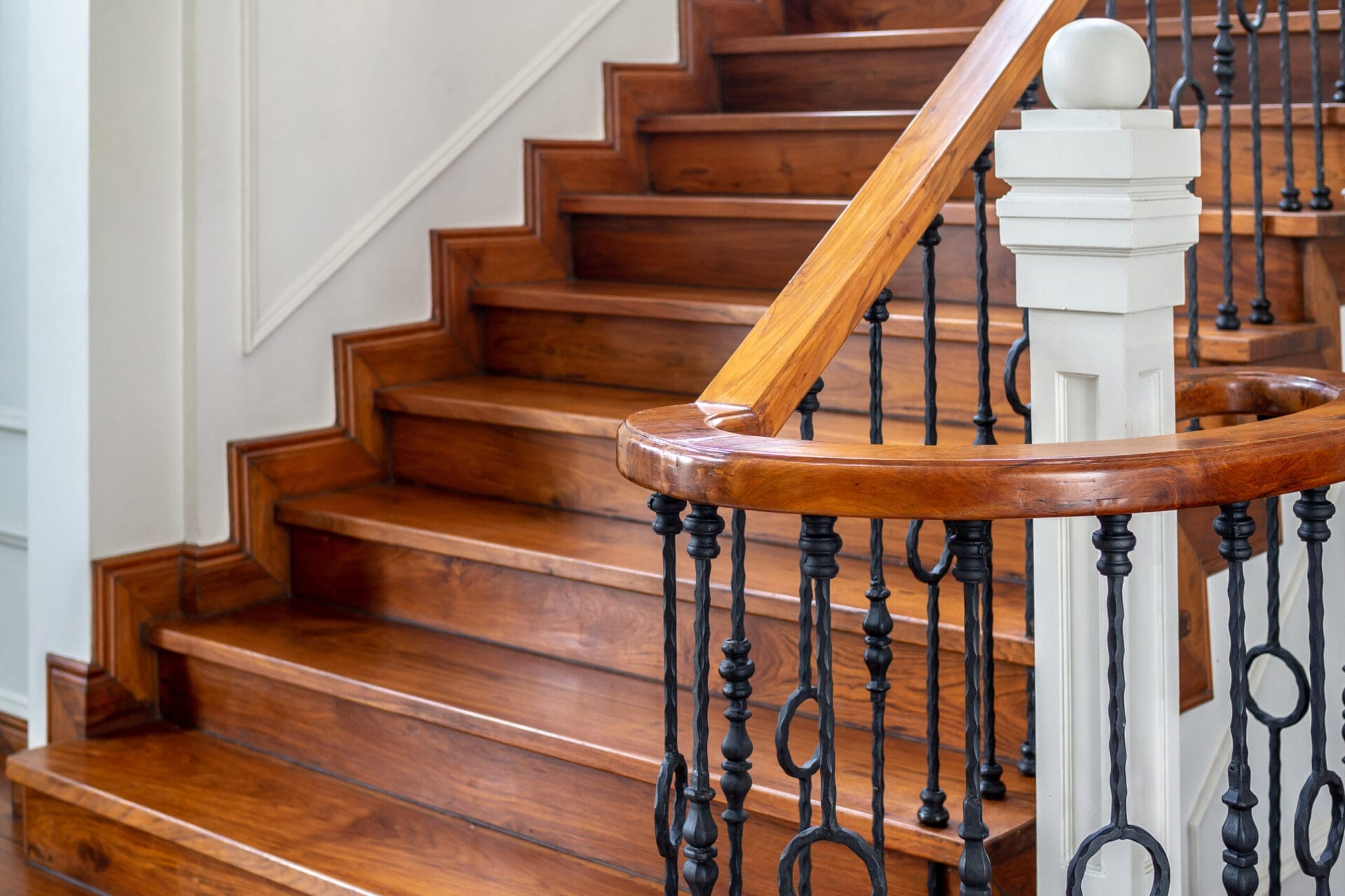 Grand staircase with ornamental metal work.