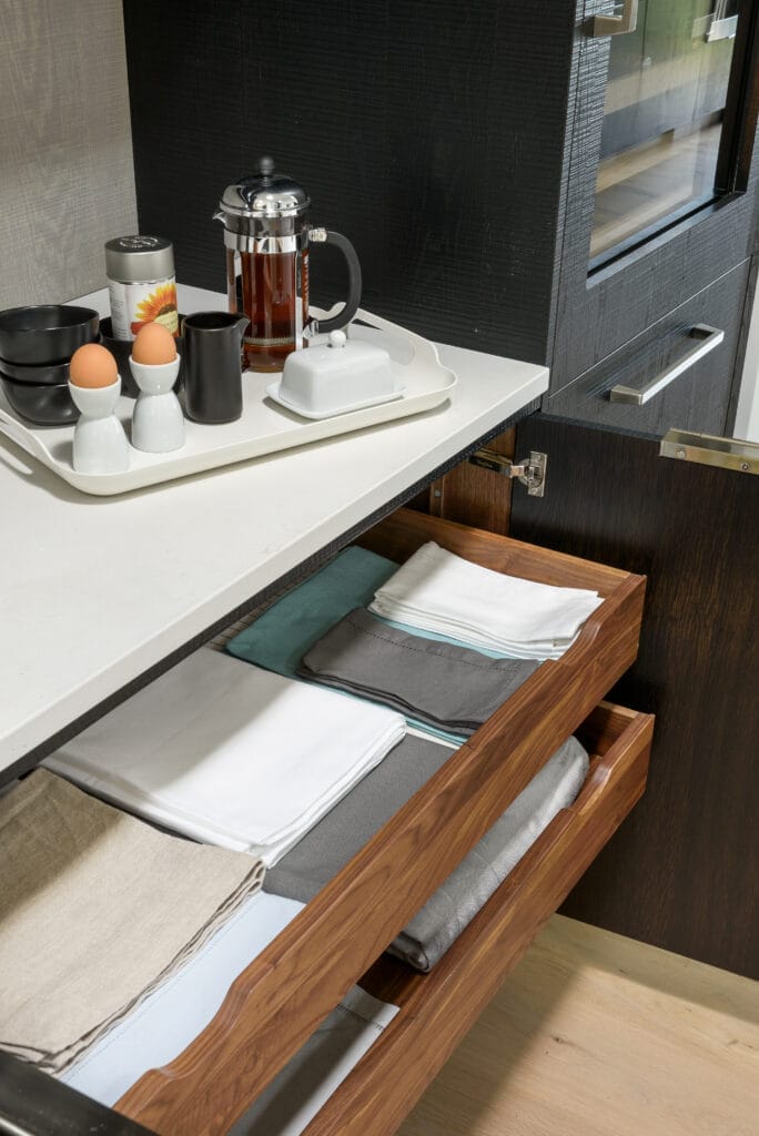 a finished pull-out kitchen shelf within a cabinet