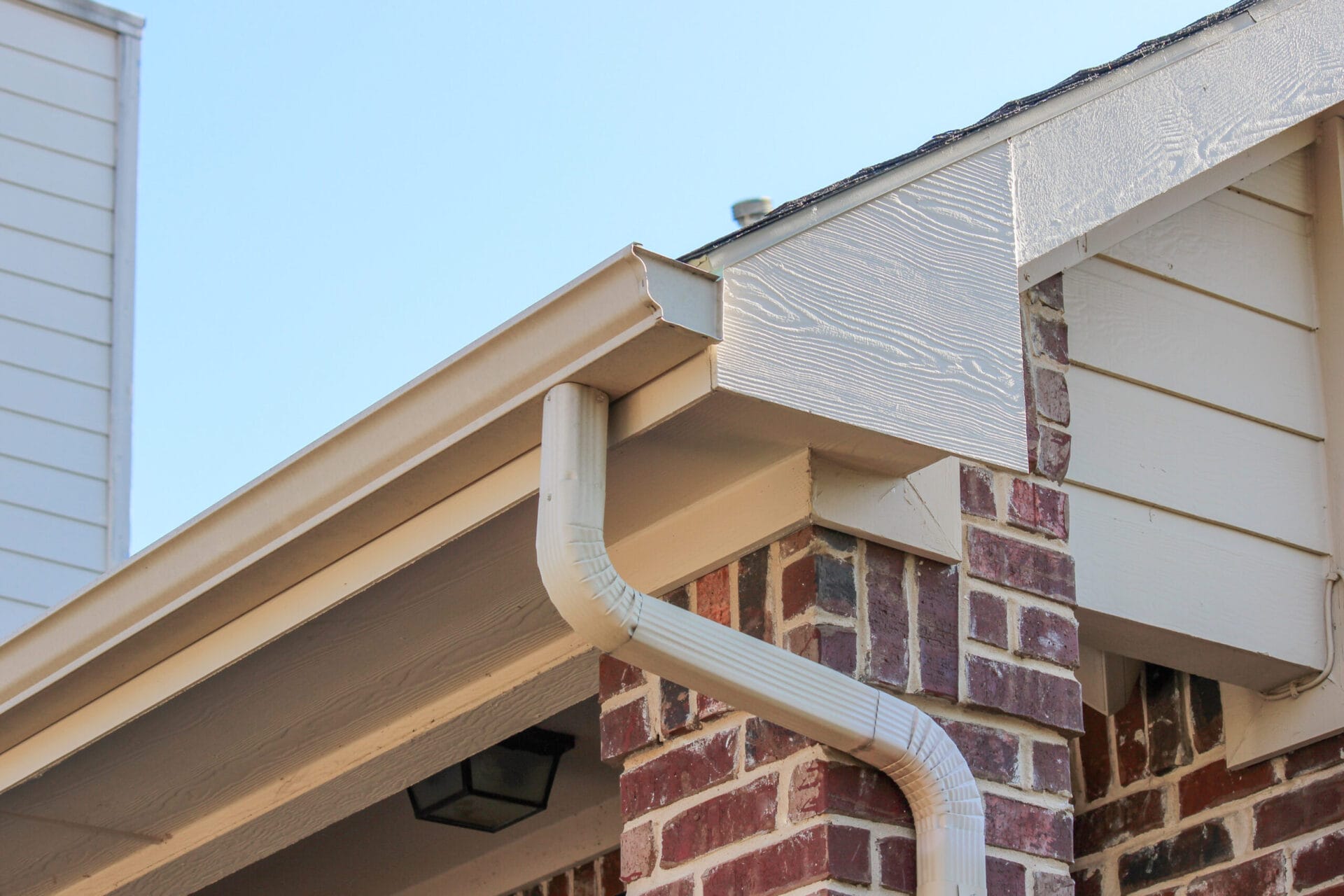 White K-style gutter on a house.