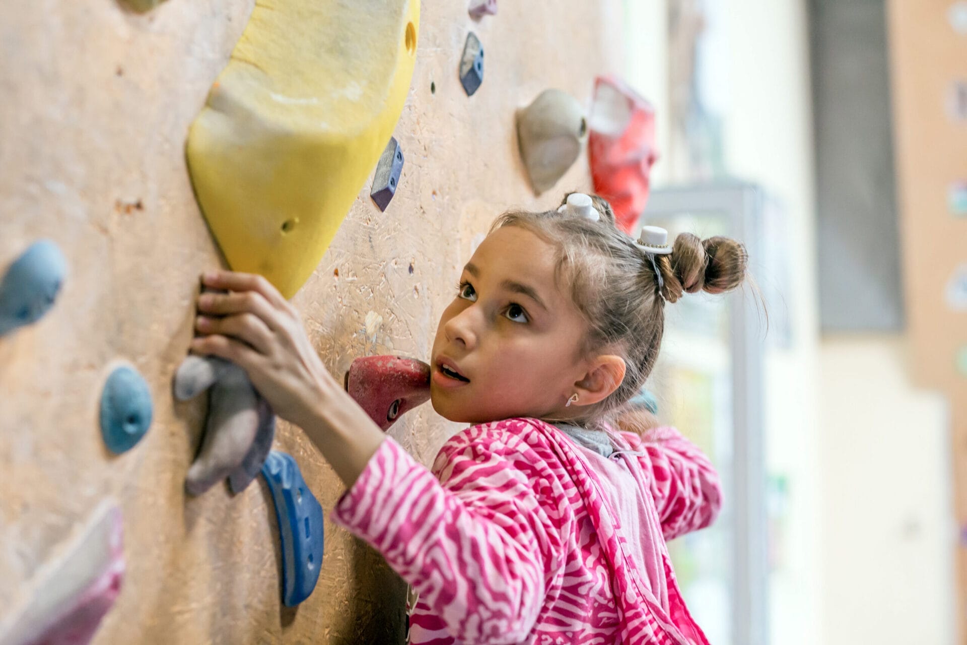 A child climbing a rock wall.