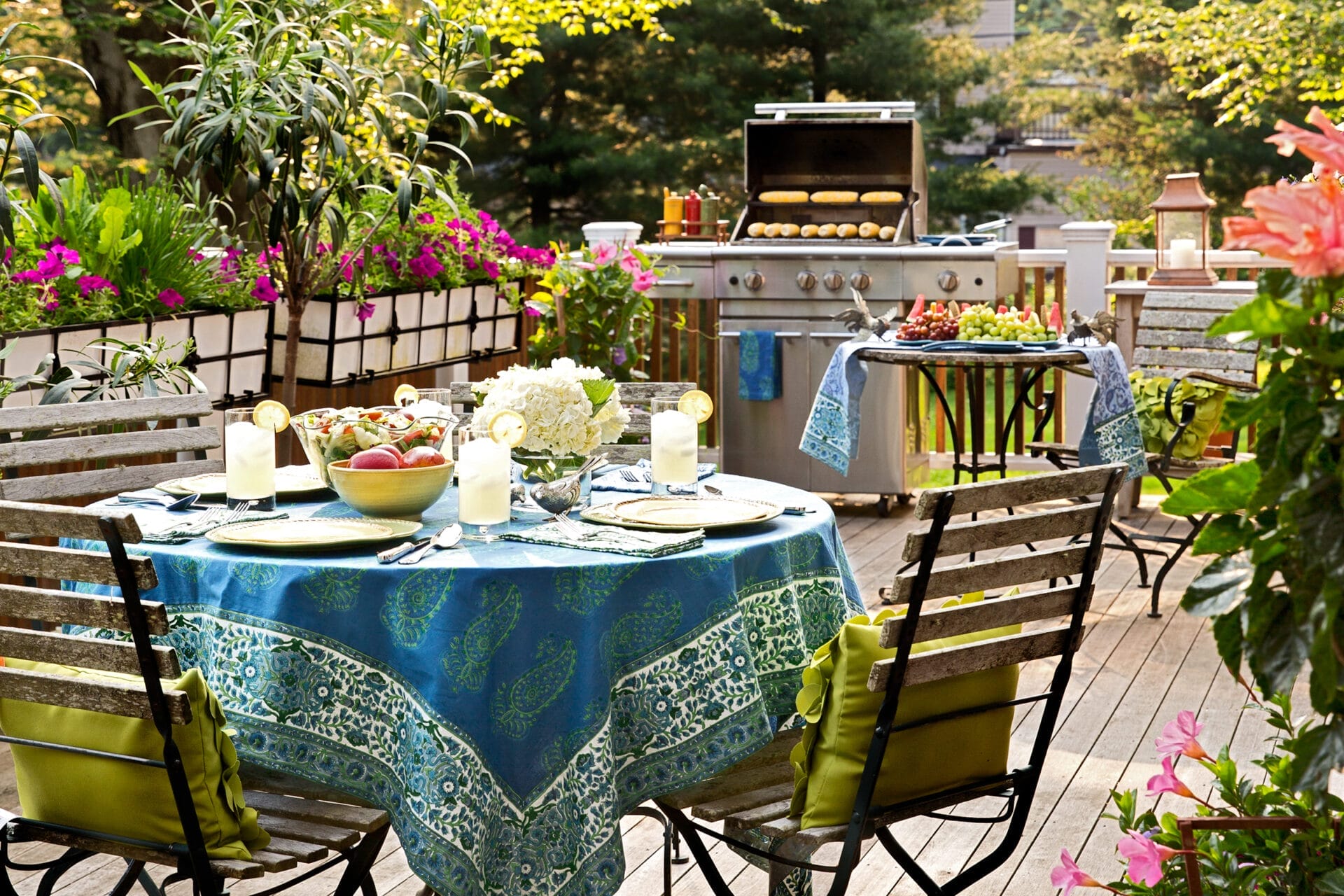 a table set for dinner and a grill