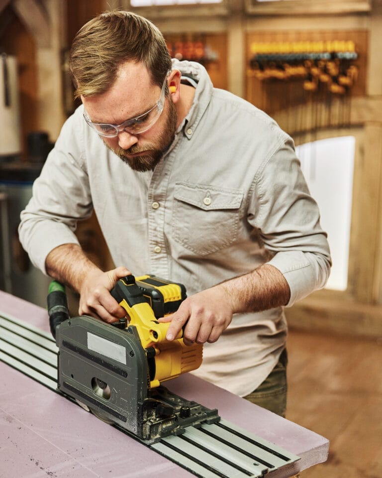 A track saw being used on a table