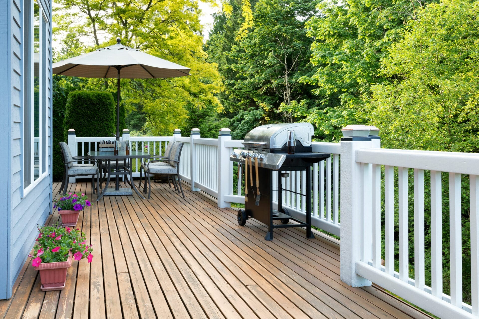 A deck with a grill on it that may hurt it's lifespan.