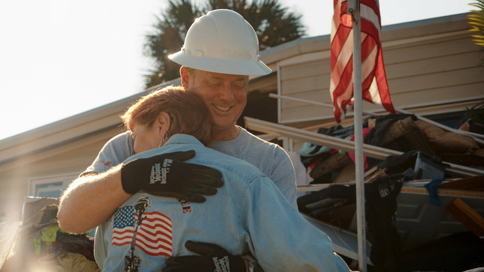 Kevin O'Connor hugs a volunteer