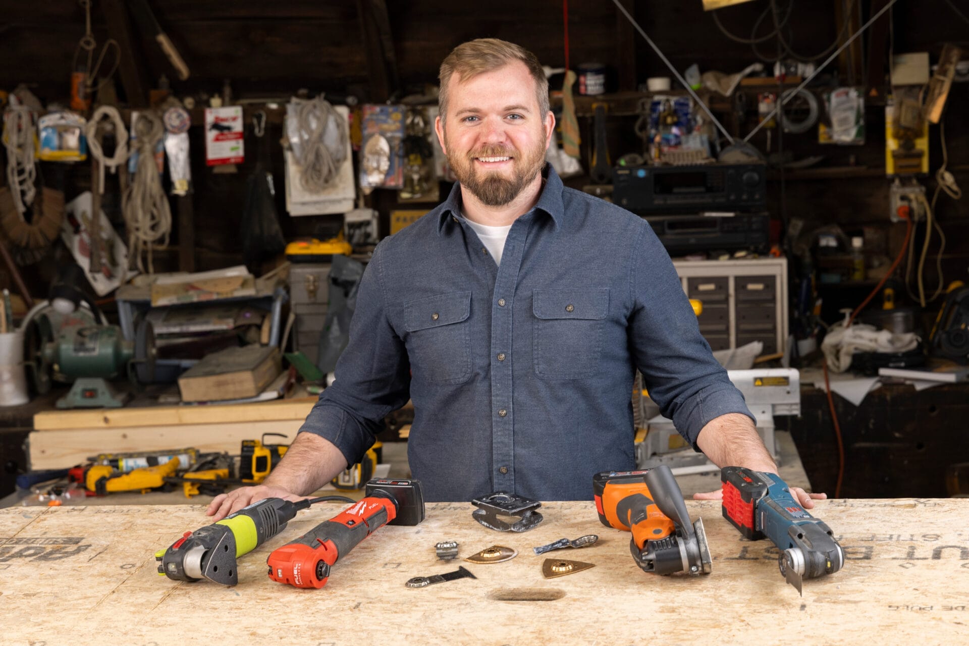 Portrait of Nathan Gilbert with oscillating multitools.