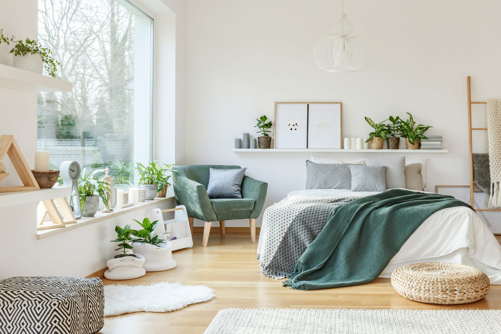 Open airy bedroom full of plants