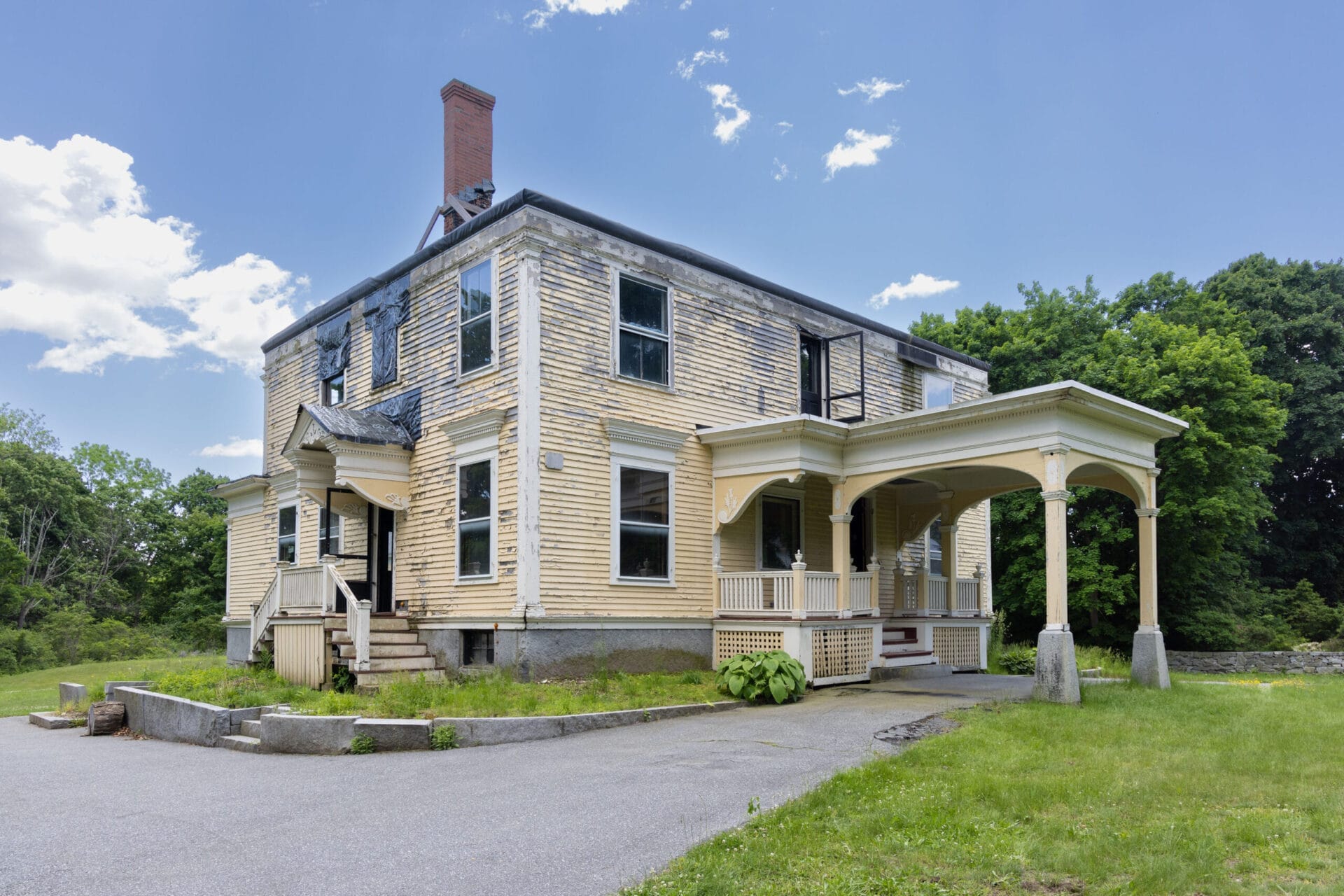Colonial house with fire damage in Westford MA