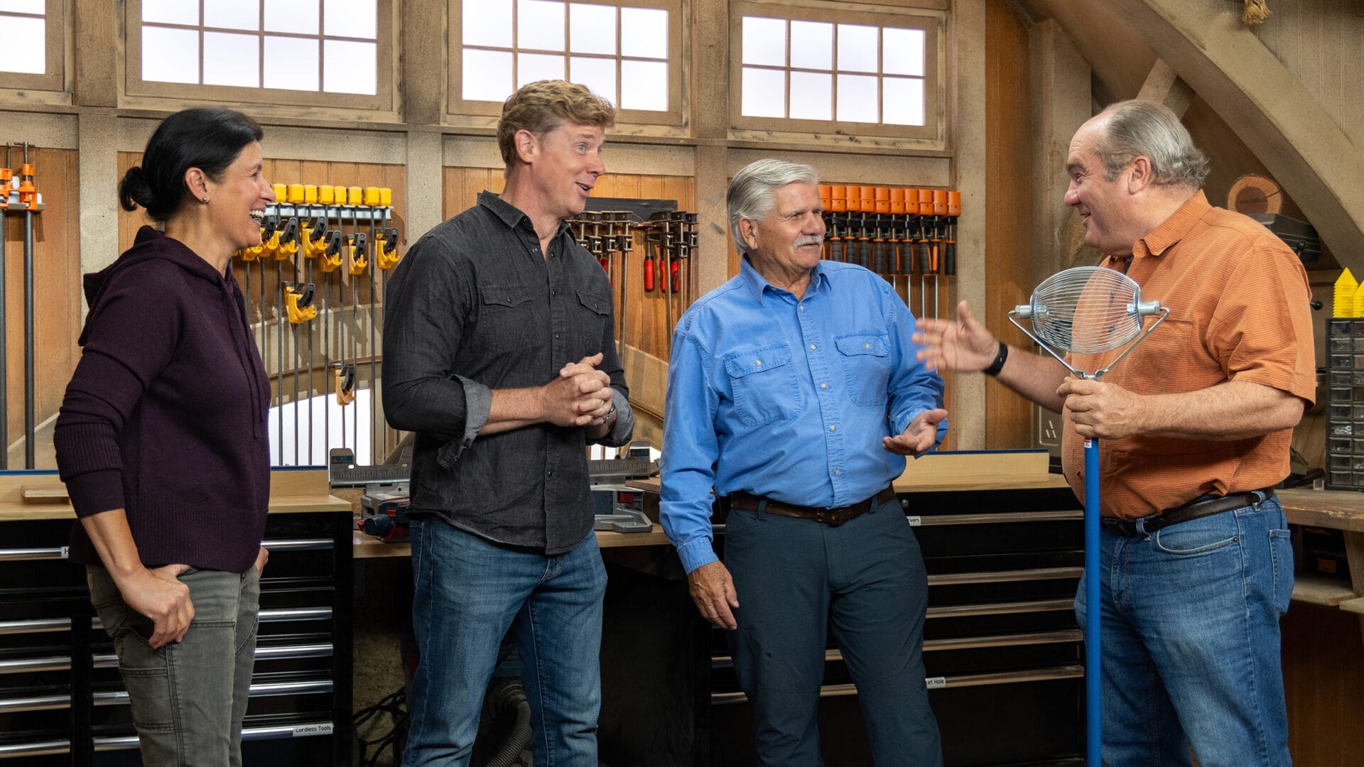 S24 E2: Jenn Nawada presents a spiral wire broom to Kevin O'Connor, Tom Silva, and Richard Trethewey